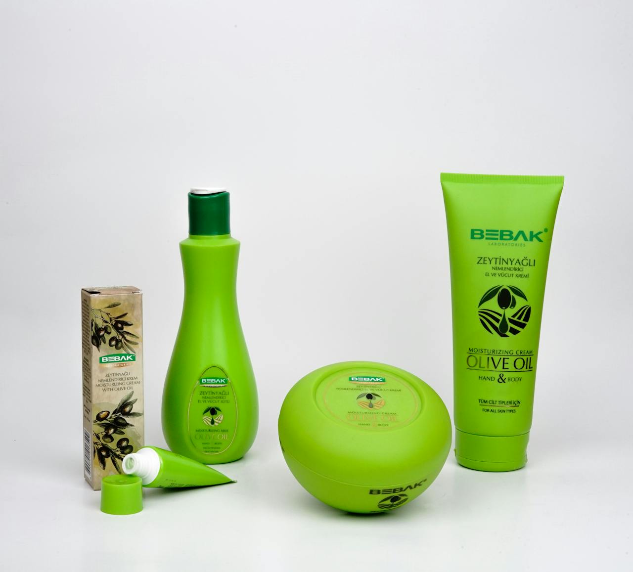 Elegant arrangement of Bebak olive oil skincare products for promotional use.